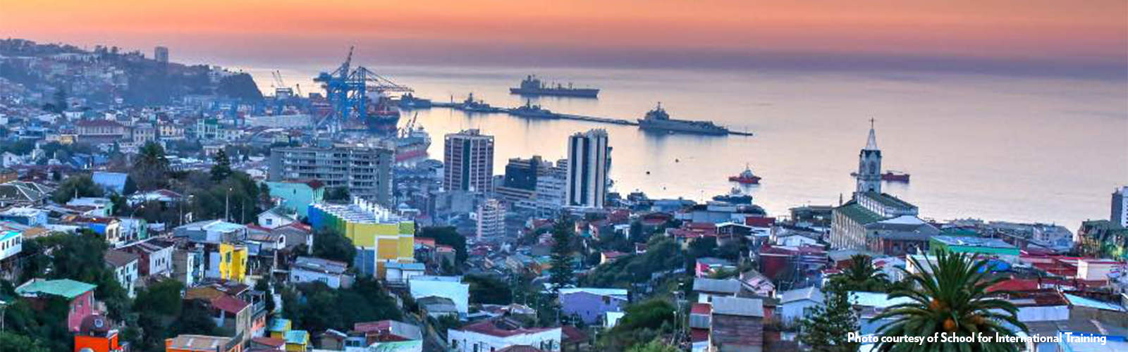 Skyline view of Arica during sunset, highlighting both the modern and old architecture.